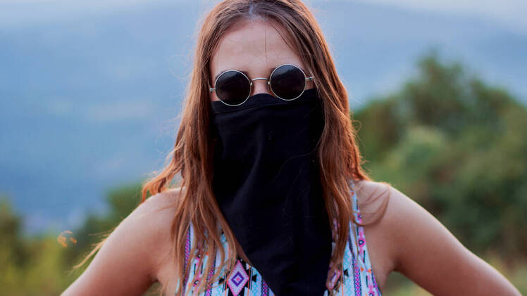 Woman wearing long neck gaiter mask