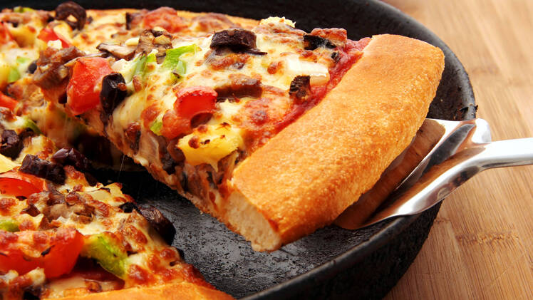 Pizza being reheated in skillet