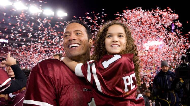 father holding daughter; best movies to watch with dad