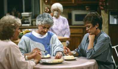 The Golden Girls at the kitchen table eating cheesecake