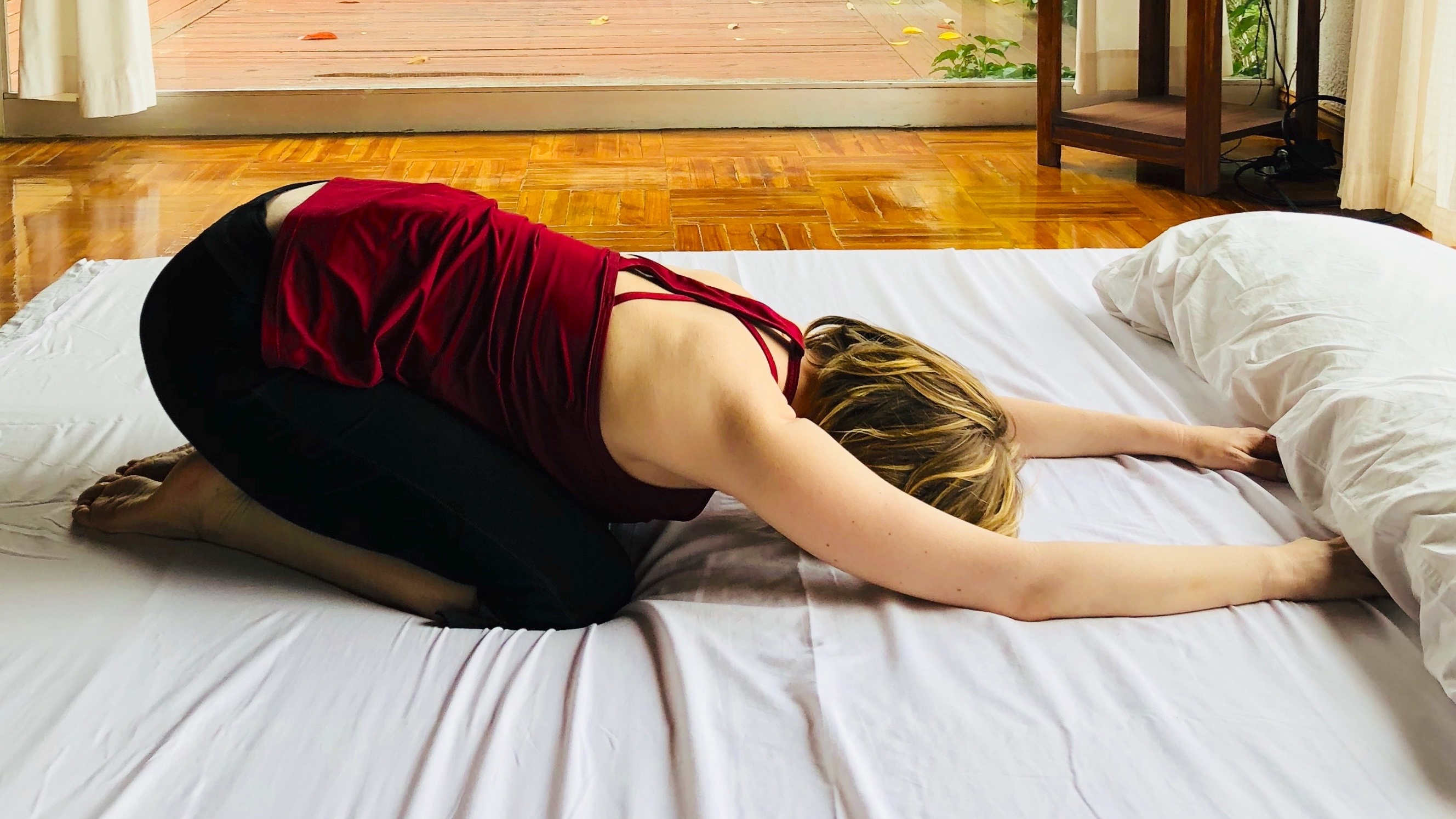 In-Bed Yoga Poses For When You're Feeling Extra Lazy - Fitbit Blog