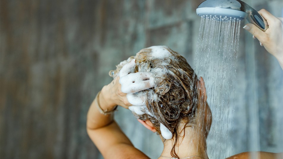https://www.firstforwomen.com/wp-content/uploads/sites/2/2021/03/Woman-washing-her-hair-in-the-shower.jpg?w=953