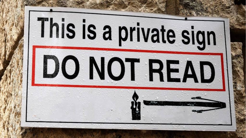 A funny street sign on a wall in Kotor, Montenegro saying "this is a private sign, Do Not Read! (Funny road signs )