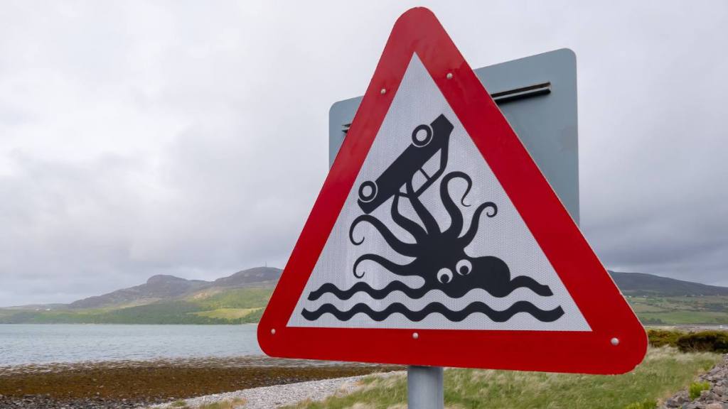 A humorous road sign beside a causeway near the coastal village of Tongue in the northwest of Scotland. (Funny road signs )