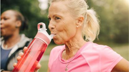 Mature woman using an emotional support water bottle