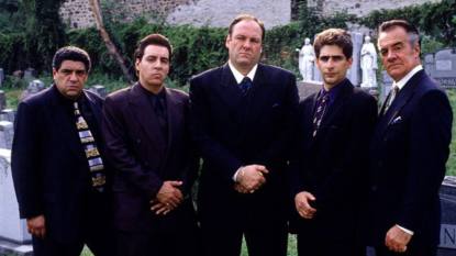 five men standing in suits; the sopranos cast