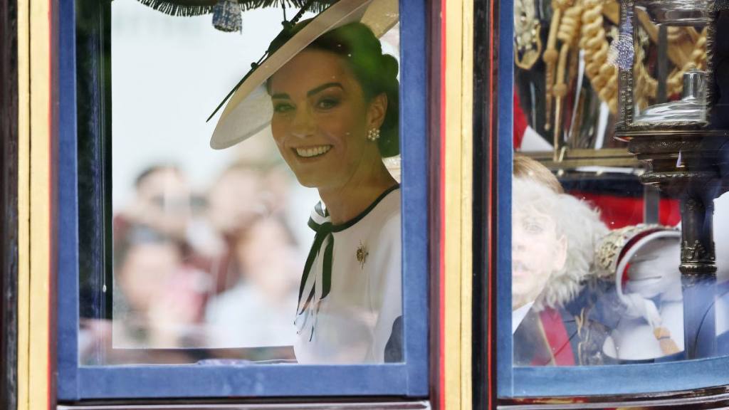woman looking out window; kate middleton trooping the colour 

