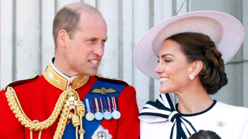 man and woman smiling at each other; kate middleton trooping the colour 
