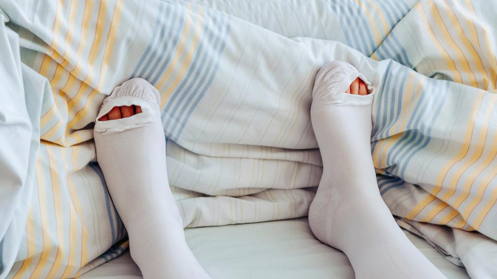 A woman wearing white compression socks