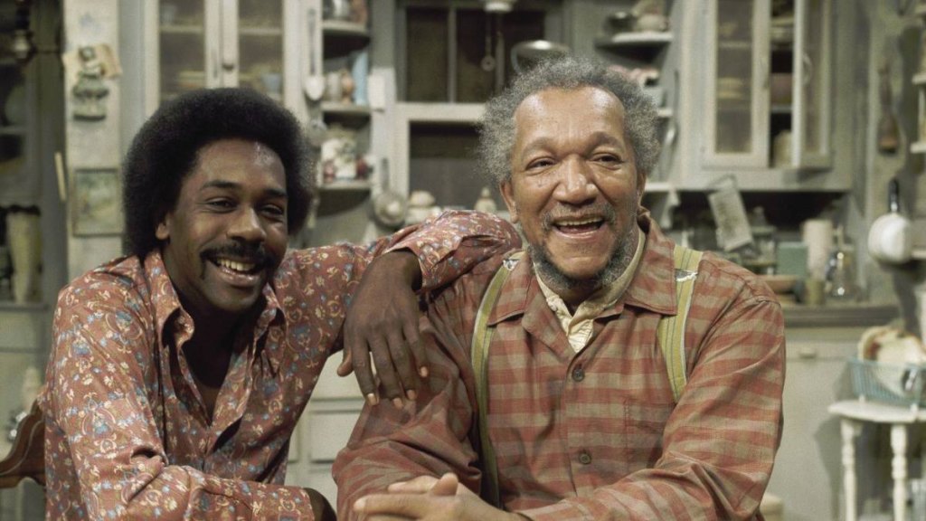 Redd Foxx and Demond Wilson in ‘Sanford and Son' (1973), having a laugh in their kitchen.