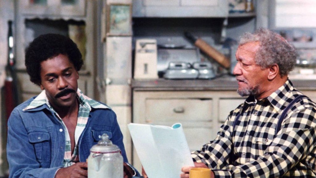 Redd Foxx and Demond Wilson in ‘Sanford and Son' (1975), having a serious discussion in the kitchen.