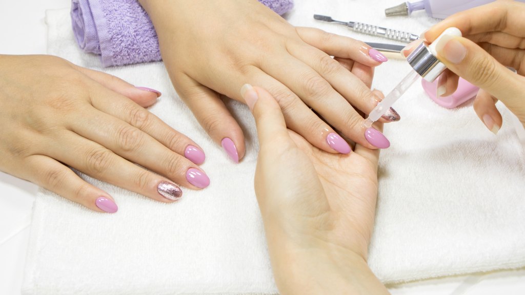 woman getting nails done in salon