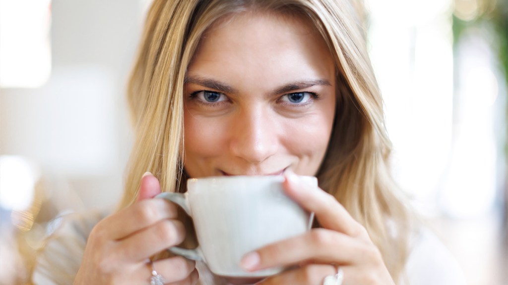 woman sipping coffee as part of the coffee loophole