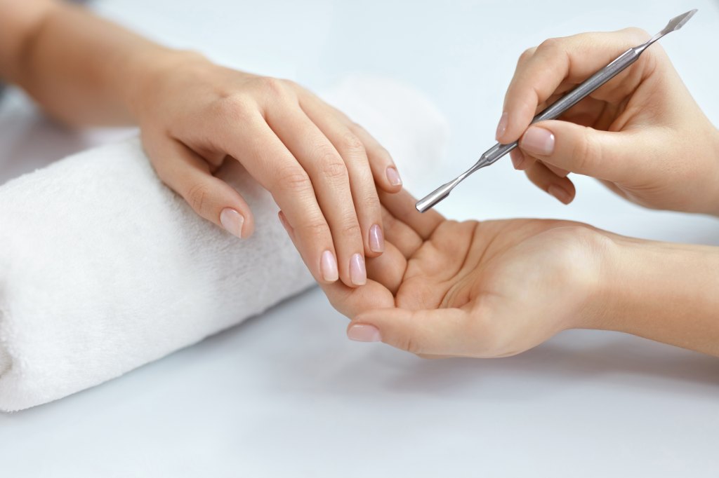 Woman getting her nails done