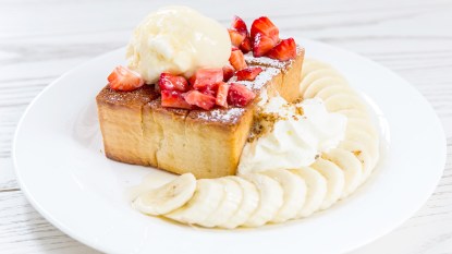Honey butter toast with fruit, ice cream and whipped cream