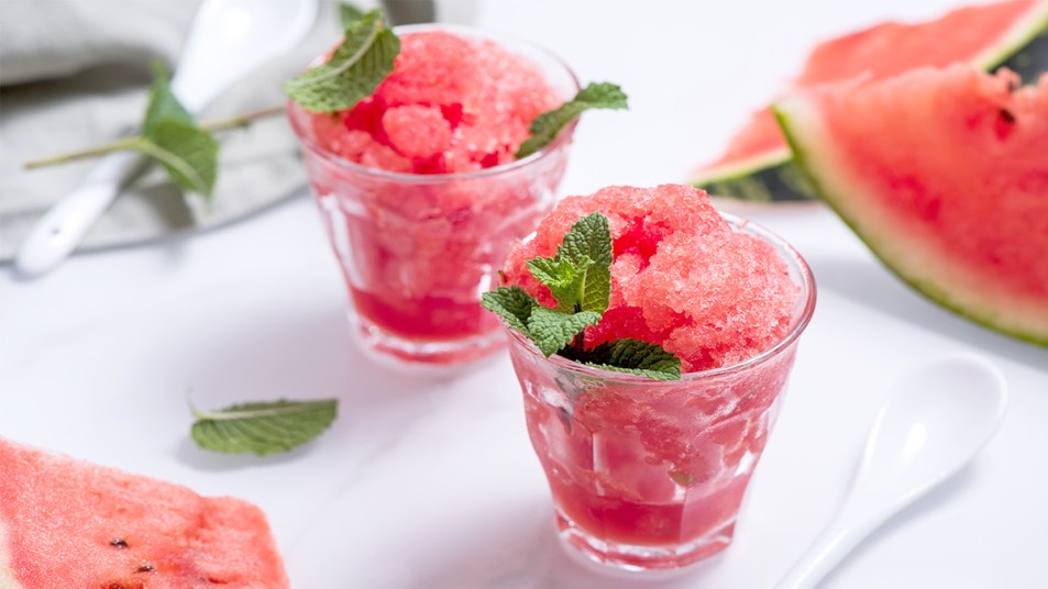 Watermelon shaved ice in glasses and garnished with mint