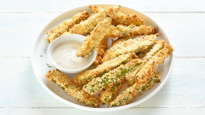 Air fryer zucchini fries served with a creamy dip